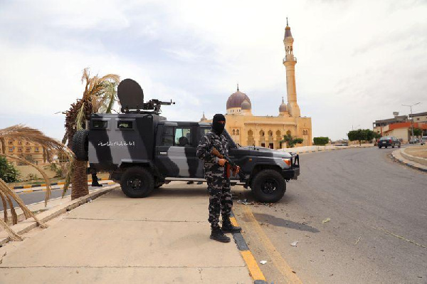 A member of security forces loyal to Libya's internationally recognised government holding a weapon