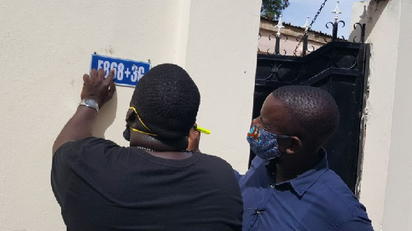 Bakary Suso (L) and Alieu Sowe, (R) are putting up the signs themselves