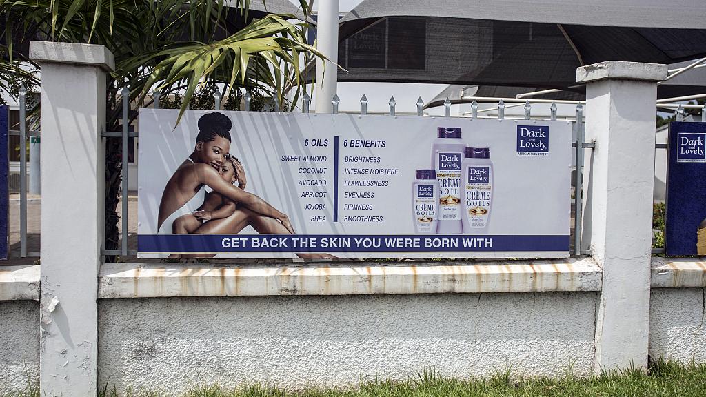 File- A billboard advertises products to restore natural skin colour on Spintex Road in Accra, Ghana, on July 2, 2018