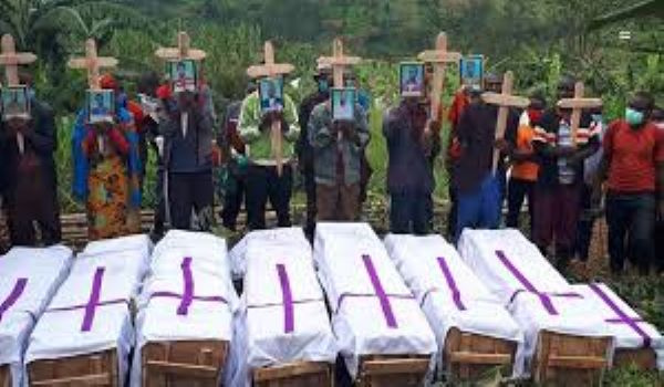 Mourners at the funeral of eight members of a family killed in landslide