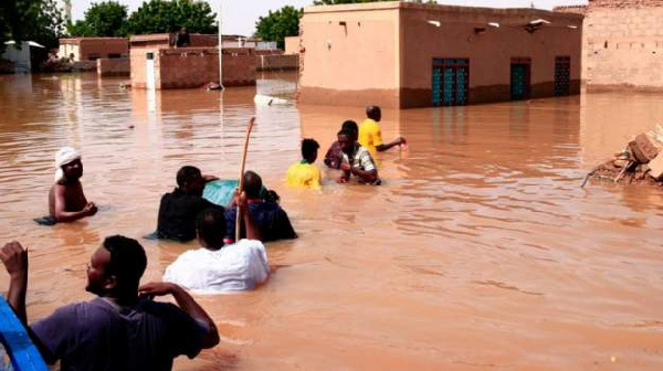 Nearly 100 people have died after torrential rains