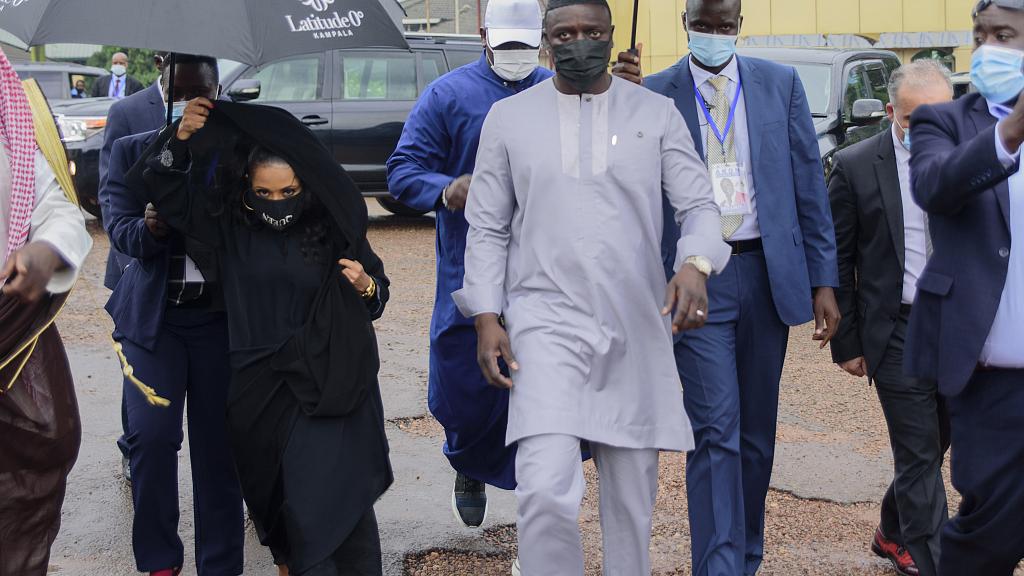 Senegalese - American performer Akon, right and his wife Rozina, arrive at the Gaddafi National mosque, in Kampala, Uganda, 