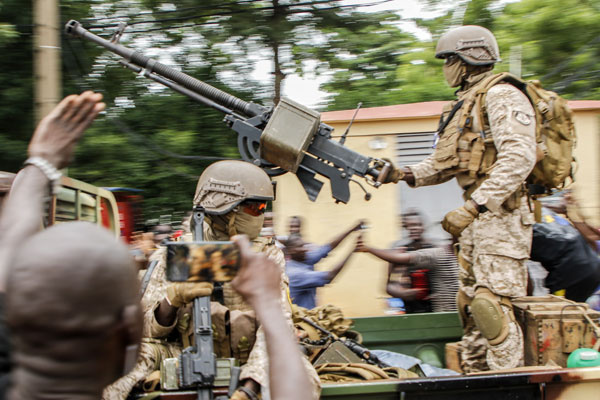 The mutinying soldiers were cheered by crowds as they reached the capital Bamako on Tuesday