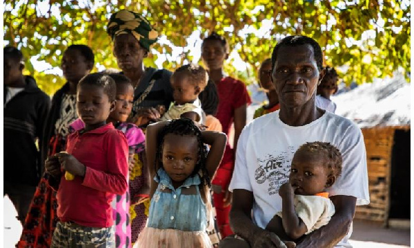 Vicente (right) heads a family of 30 people who fled the armed attacks in Mozambique