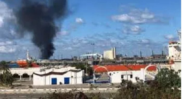 Smoke rises from the port in Tripoli after being attacked in Libya