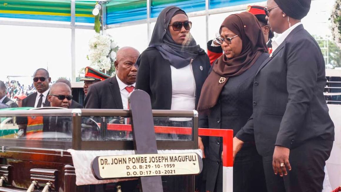 Tanzania's new President Samia Suluhu Hassan (second right) mourns beside the coffin of the late Tanzanian President John Magufuli during his national funeral at Jamhuri Stadium in Dodoma, central Tanzania on March 22, 2021.