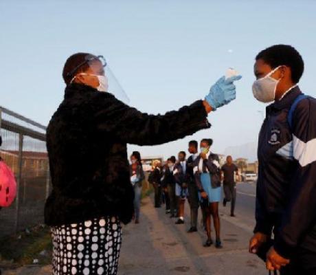 A learner is screened as schools begin to reopen after COVID-19 lockdown in Langa in Cape TOWN