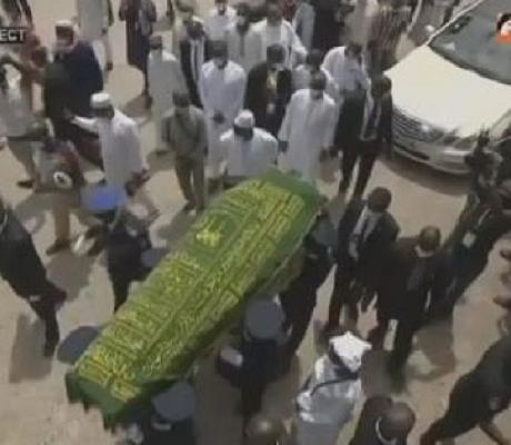 Before Amadou Gon Coulibaly's burial, relatives surrounded his remains and prayed for him