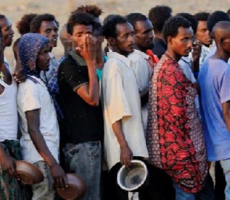 Ethiopians who fled fighting in Tigray queue for food at Um-Rakoba camp on the Sudan-Ethiopia border