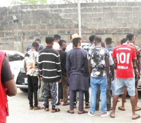 File photo of EFCC official parading suspects