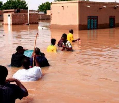 Nearly 100 people have died after torrential rains
