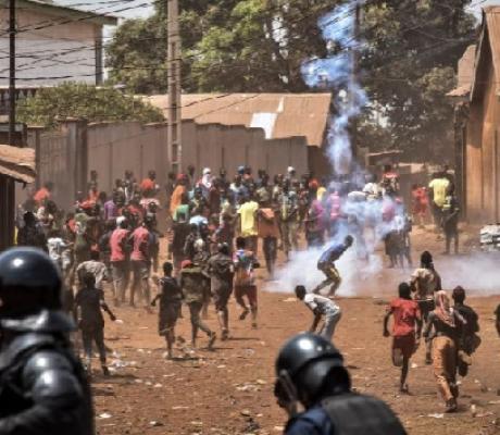 Police throw rocks and fire tear gas at protesters in the opposition stronghold of Wanindara, Guinea