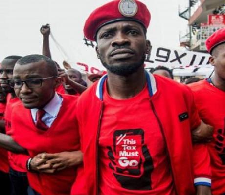 Uganda's opposition presidential candidate, Bobi Wine flanked by others