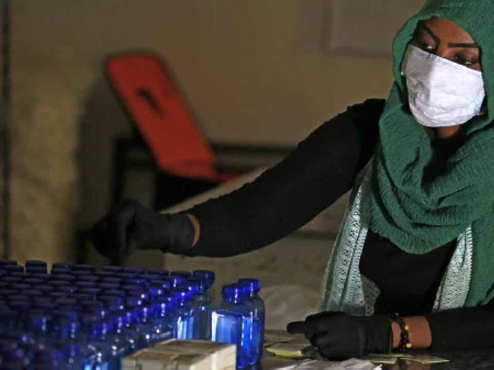 A Sudanese medical laboratory student prepare sterilisers to combat the spread of Covid-19