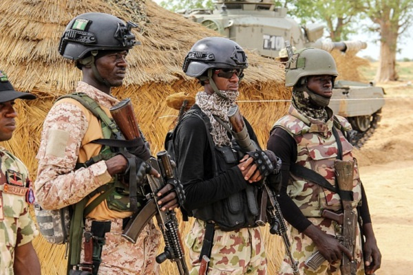 Nigerian Army soldiers stand at a base in Baga on August 2, 2019. (Photo by AUDU MARTE/AFP/Getty Ima