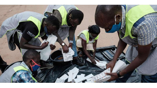 Electoral commission officials start to count ballot papers for the presidential election, | AFP