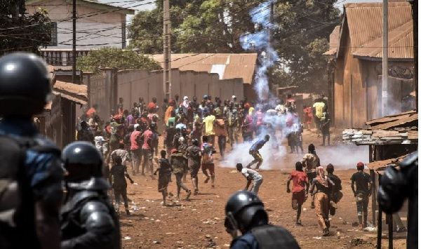 Police throw rocks and fire tear gas at protesters in the opposition stronghold of Wanindara, Guinea