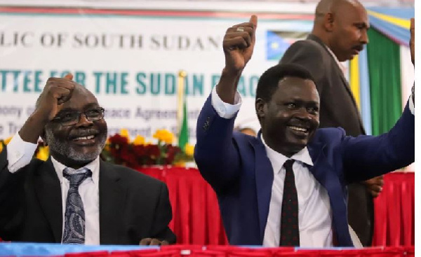 Rebels leaders gesture after the signing of the peace agreement