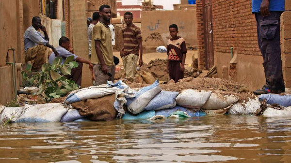 Residents of Sudan's Tuti Island have been filling bags with sand and small stones to stop the flood