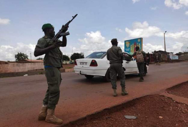 Soldiers patrol after gunshots were heard Tuesday at a military camp near Kati area in Bamako, Mali