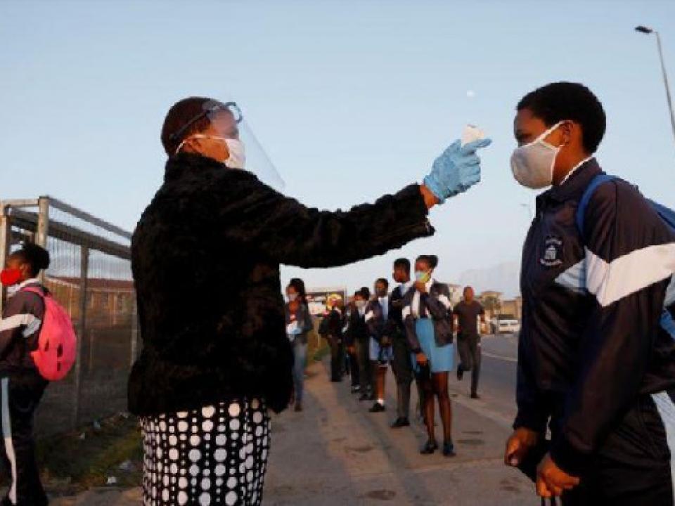 A learner is screened as schools begin to reopen after COVID-19 lockdown in Langa in Cape TOWN