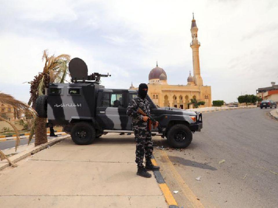 A member of security forces loyal to Libya's internationally recognised government holding a weapon