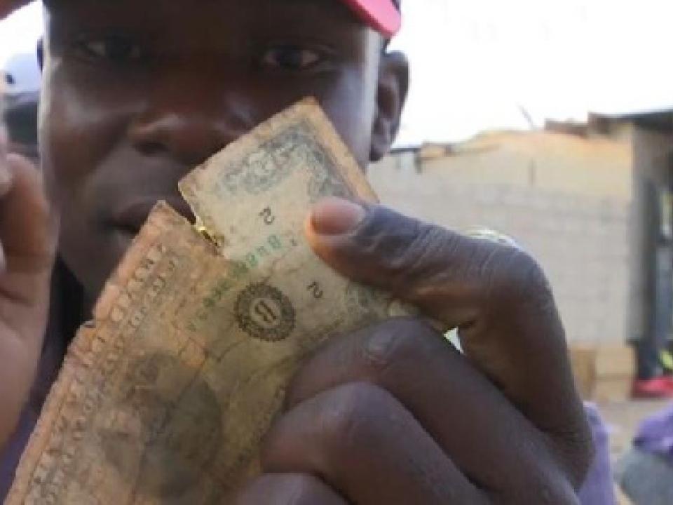 Dealers buy the tattered notes and make profits off the black market