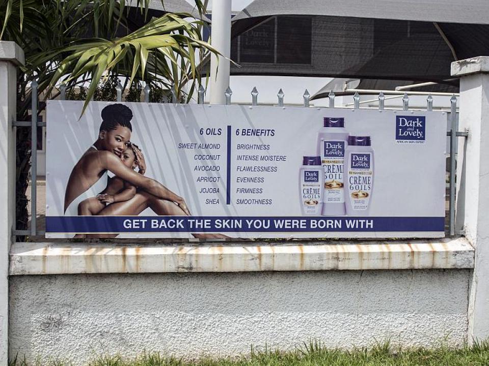 File- A billboard advertises products to restore natural skin colour on Spintex Road in Accra, Ghana, on July 2, 2018