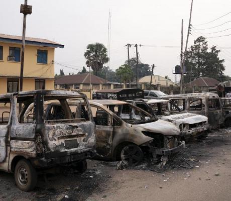Burned vehicles are parked outside the police command headquarters in Owerri, Nigeria, on Monday, April 5, 2021