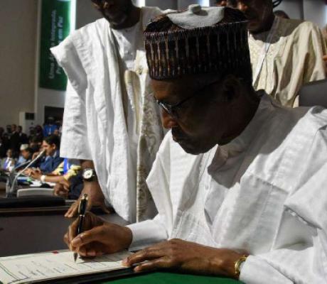 Nigerian President Muhammadu Buhari signs the AfCFTA ( AFP)