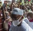 Guinean President Alpha Condé was guided through the crowd during his visit to the police officers