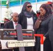 Tanzania's new President Samia Suluhu Hassan (second right) mourns beside the coffin of the late Tanzanian President John Magufuli during his national funeral at Jamhuri Stadium in Dodoma, central Tanzania on March 22, 2021.
